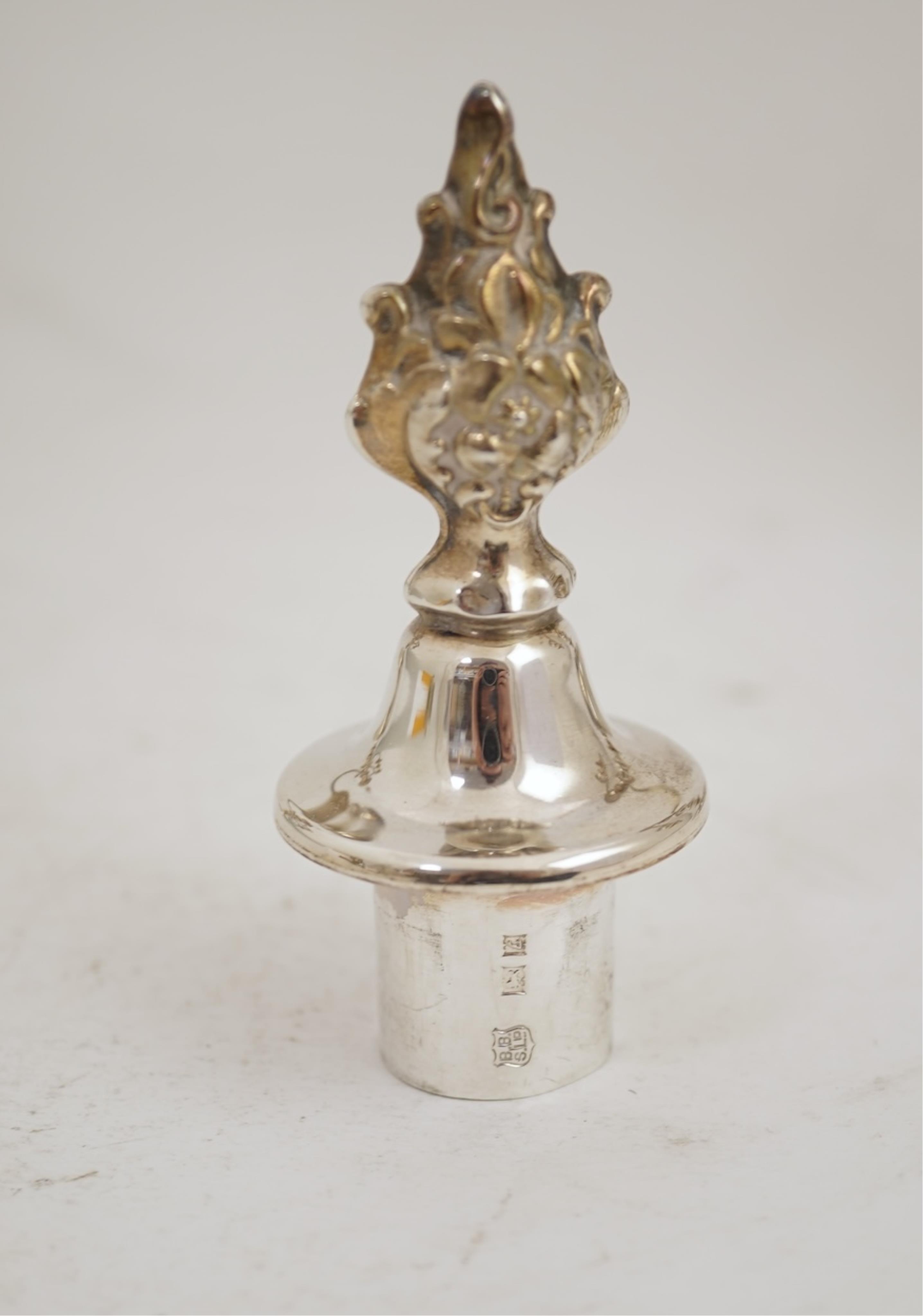 A pair of Elizabeth II silver dwarf two branch, three light candelabra by Barker Brothers Silver Co, with scroll arms and turned knopped stems, Birmingham, 1960, weighted, arms 52oz.